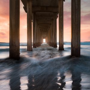 Preview wallpaper pier, sea, waves, pillars, water