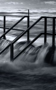 Preview wallpaper pier, sea, waves, storm, black and white