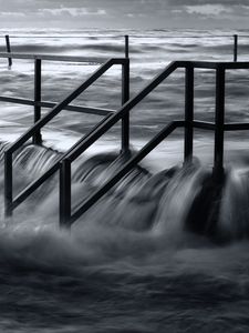 Preview wallpaper pier, sea, waves, storm, black and white