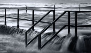 Preview wallpaper pier, sea, waves, storm, black and white