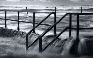 Preview wallpaper pier, sea, waves, storm, black and white