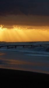 Preview wallpaper pier, sea, waves, light, beams