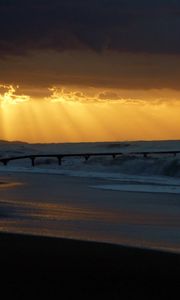 Preview wallpaper pier, sea, waves, light, beams