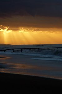 Preview wallpaper pier, sea, waves, light, beams