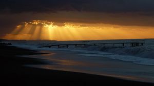 Preview wallpaper pier, sea, waves, light, beams