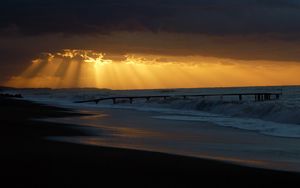 Preview wallpaper pier, sea, waves, light, beams