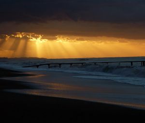 Preview wallpaper pier, sea, waves, light, beams