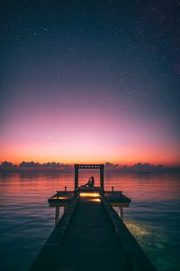 Preview wallpaper pier, silhouette, loneliness, twilight, starry sky