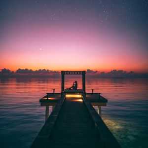 Preview wallpaper pier, silhouette, loneliness, twilight, starry sky