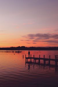 Preview wallpaper pier, silhouette, sunset, lake, loneliness