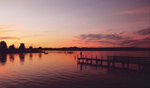 Preview wallpaper pier, silhouette, sunset, lake, loneliness