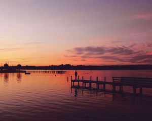 Preview wallpaper pier, silhouette, sunset, lake, loneliness