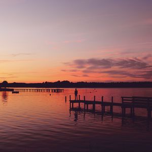 Preview wallpaper pier, silhouette, sunset, lake, loneliness