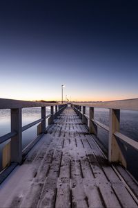 Preview wallpaper pier, snow, bridge, sunset, helsinki, finland