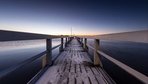 Preview wallpaper pier, snow, bridge, sunset, helsinki, finland