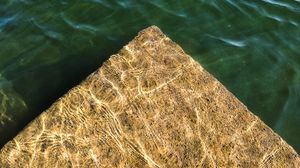 Preview wallpaper pier, stone, water, glare