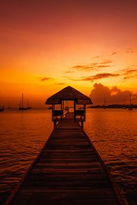 Preview wallpaper pier, structure, sea, boats, sunset, dark