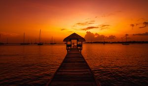 Preview wallpaper pier, structure, sea, boats, sunset, dark