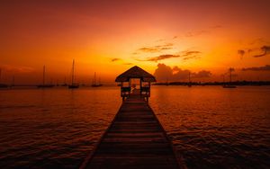 Preview wallpaper pier, structure, sea, boats, sunset, dark