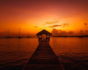 Preview wallpaper pier, structure, sea, boats, sunset, dark