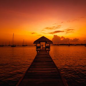 Preview wallpaper pier, structure, sea, boats, sunset, dark