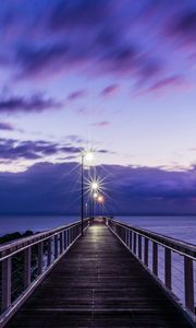 Preview wallpaper pier, sunset, horizon, sea, lilac, clouds