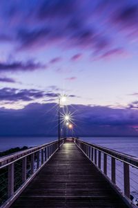 Preview wallpaper pier, sunset, horizon, sea, lilac, clouds