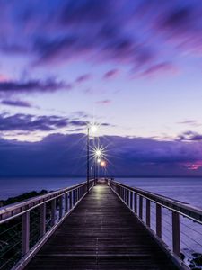 Preview wallpaper pier, sunset, horizon, sea, lilac, clouds