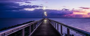 Preview wallpaper pier, sunset, horizon, sea, lilac, clouds