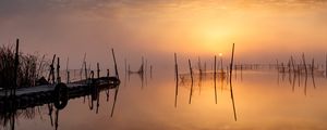 Preview wallpaper pier, sunset, lake, fishing nets