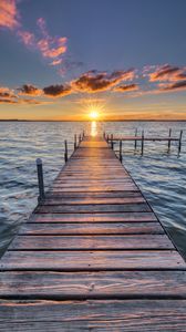 Preview wallpaper pier, sunset, rays, horizon, sea