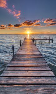 Preview wallpaper pier, sunset, rays, horizon, sea