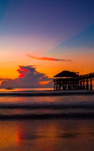 Preview wallpaper pier, sunset, sea, clouds, beach, surf