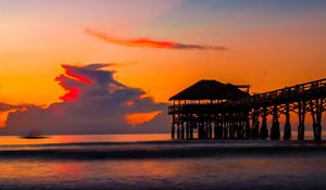 Preview wallpaper pier, sunset, sea, clouds, beach, surf