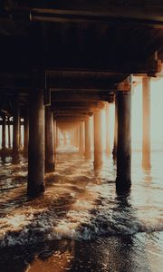 Preview wallpaper pier, tunnel, waves, sunlight, beach