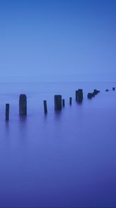 Preview wallpaper pilings, sea, twilight, minimalism