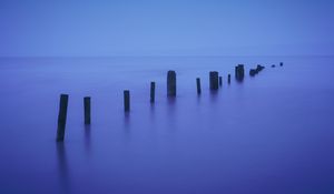 Preview wallpaper pilings, sea, twilight, minimalism