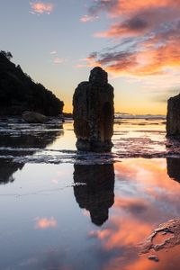 Preview wallpaper pillars, stones, water, reflection, nature, sunset