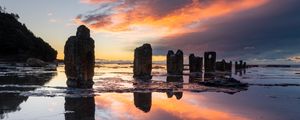 Preview wallpaper pillars, stones, water, reflection, nature, sunset