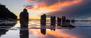 Preview wallpaper pillars, stones, water, reflection, nature, sunset