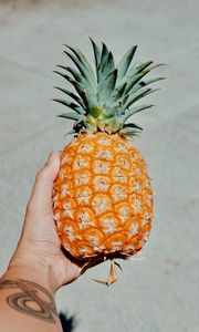 Preview wallpaper pineapple, fruit, hand, tropical