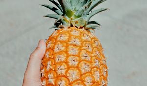 Preview wallpaper pineapple, fruit, hand, tropical