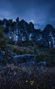 Preview wallpaper piopio, new zealand, mountains, rocks, grass, evening