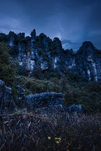 Preview wallpaper piopio, new zealand, mountains, rocks, grass, evening