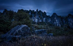 Preview wallpaper piopio, new zealand, mountains, rocks, grass, evening