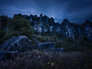 Preview wallpaper piopio, new zealand, mountains, rocks, grass, evening