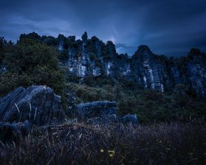 Preview wallpaper piopio, new zealand, mountains, rocks, grass, evening