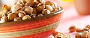 Preview wallpaper pistachios, nuts, plate, table