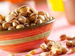 Preview wallpaper pistachios, nuts, plate, table