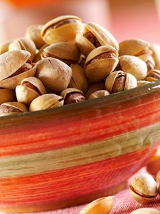 Preview wallpaper pistachios, tasty nuts, bowl